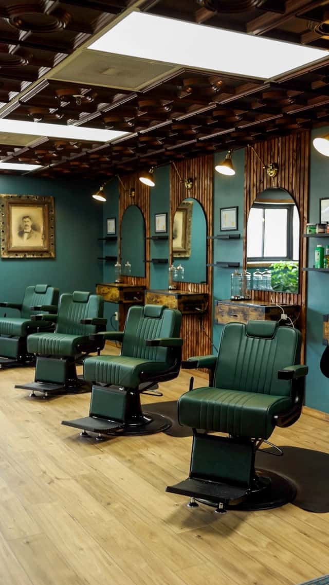 Four luxury barber chairs and stations at Cache Cuts Logan Utah premium barbershop