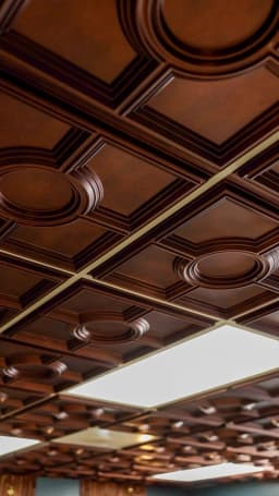 Elegant wood-paneled ceiling design at Cache Cuts premium barbershop Logan Utah — Sophisticated walnut wood ceiling creating refined cigar lounge atmosphere in Cache Valley